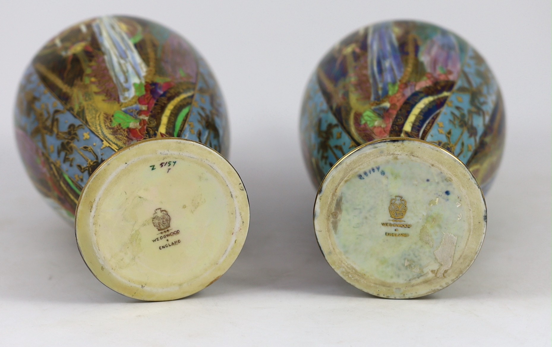 N.B. RESTORATION TO ONE VASE A pair of Wedgwood ’Candlemas’ Fairyland lustre vases, designed by Daisy Makeig-Jones, 21.5cm high